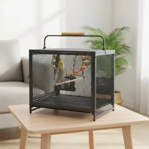 Stainless bird cage with colorful toys and a parrot inside on a wooden table