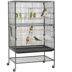 Stainless bird cage with colorful parrots perched on wooden perches